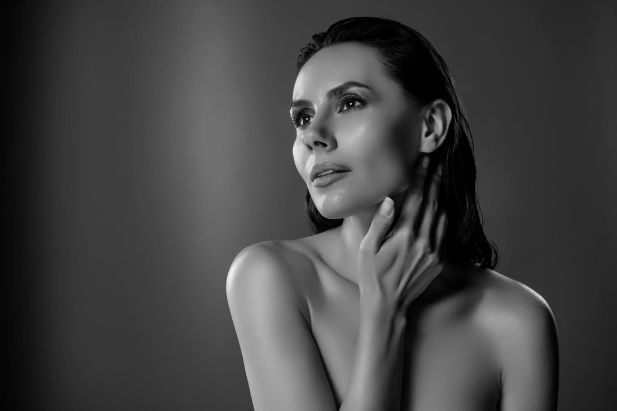 Beautiful woman showing a graceful long neck after a Botox neck lift