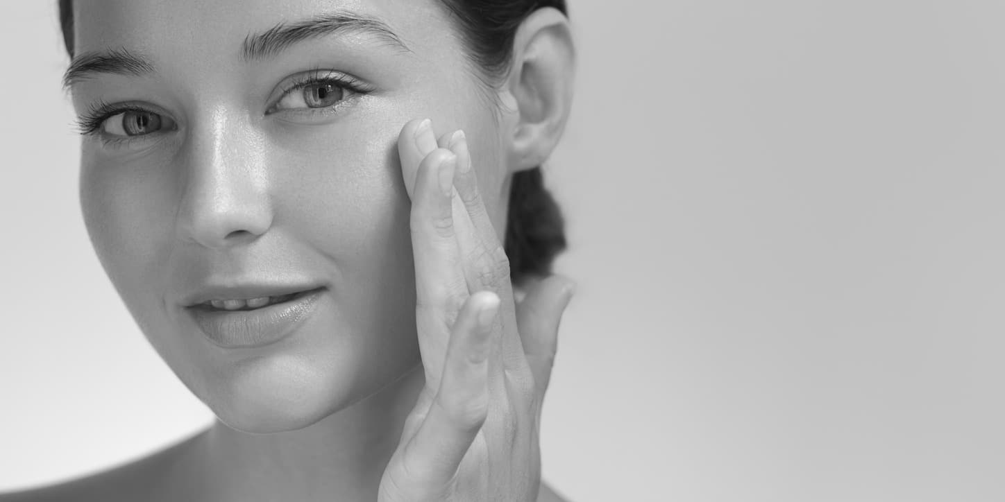 Woman receiving RF microneedling facial treatment at a medical spa